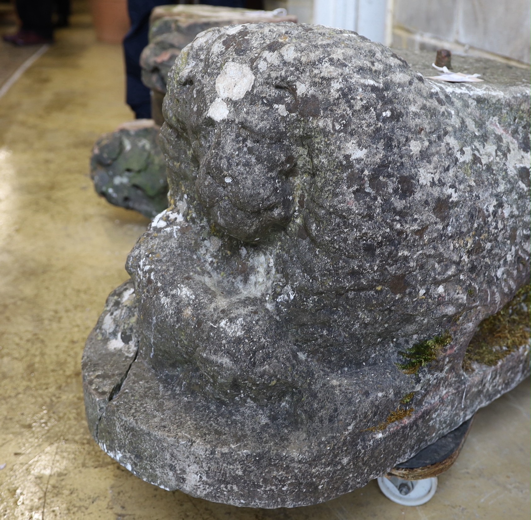 A carved stone lion, length 84cm, depth 40cm, height 45cm